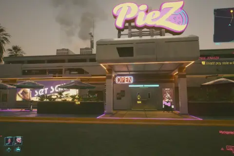 Cyberpunkowa pizzeria PieZ z neonowym znakiem. Zbliża się zadanie "Znak Jonasza", by usiąść przy stole.