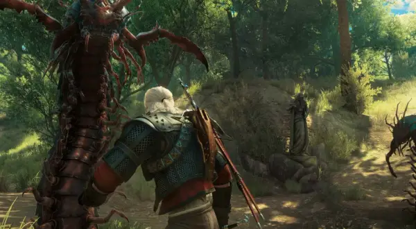 Geralt z Rivii staje naprzeciwko potężnego potwora z Wiedźmina w lesie. Inne potwory czają się w tle.