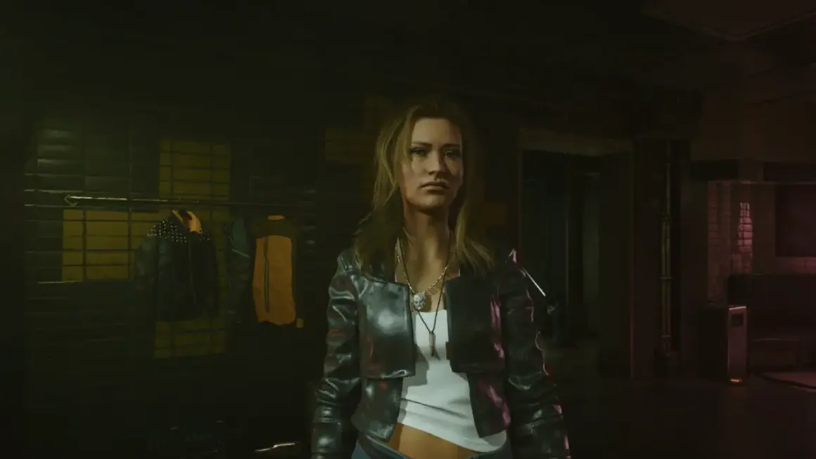 Kobieta w skórzanej kurtce, gotowa na nocne przygody w świecie cyberpunk romansów. W tle wieszaki z ubraniami.