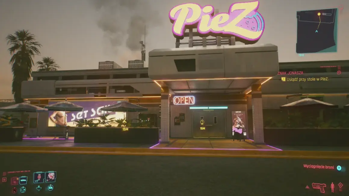 Cyberpunkowa pizzeria PieZ z neonowym znakiem. Zbliża się zadanie "Znak Jonasza", by usiąść przy stole.